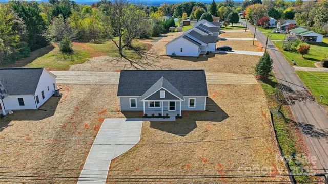 an aerial view of a house with swimming pool