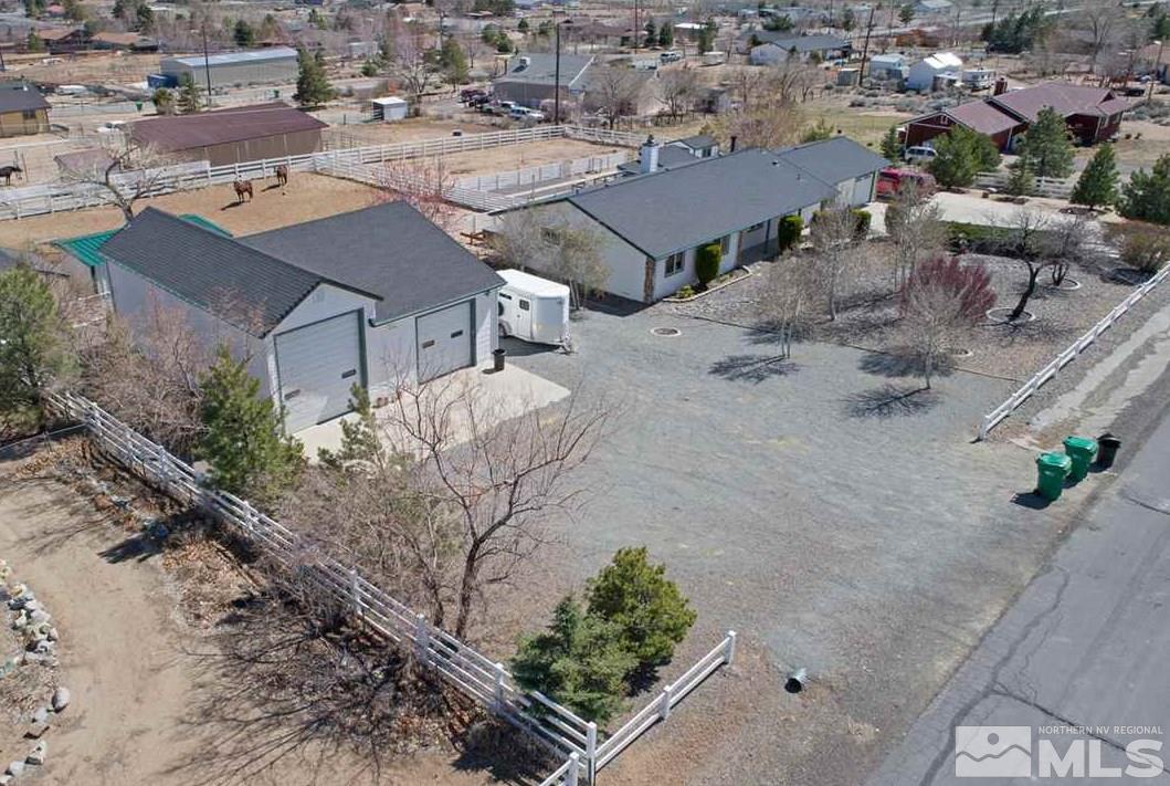 11490 Vicksburg Road Reno, NV 89508 - Photo 1 of 1 an aerial view of a house with a yard and greenery