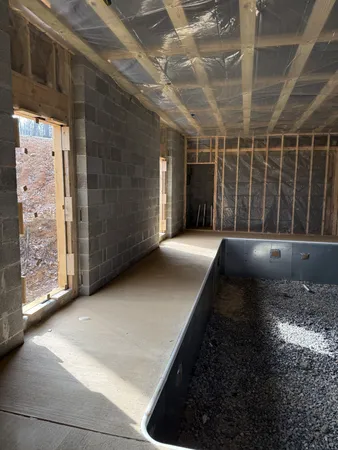 a view of a bathroom with a tub and a sink