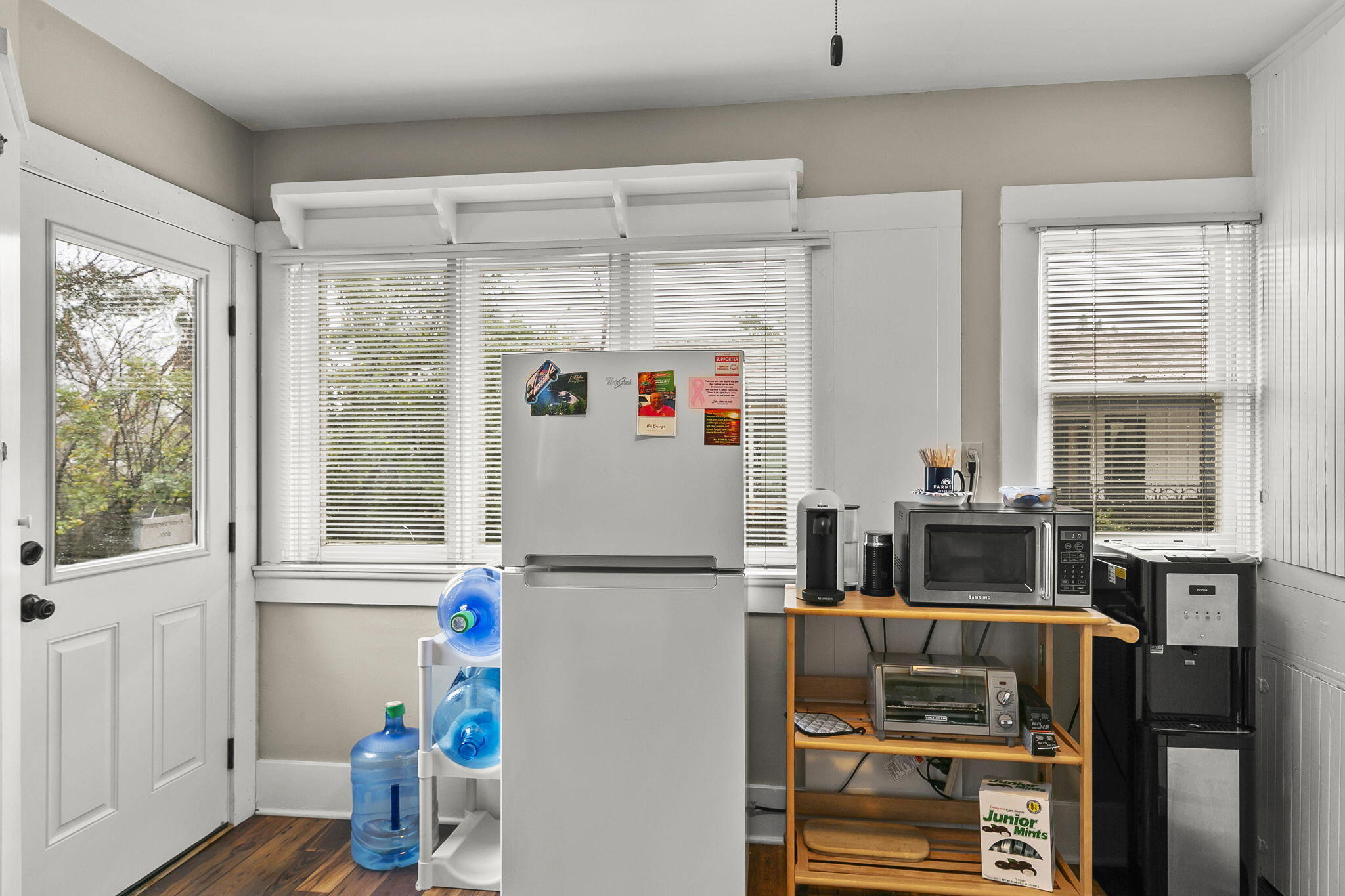 405 West Ojai Avenue Ojai, CA 93023 - Photo 18 of 21 a kitchen with a refrigerator and wooden floor