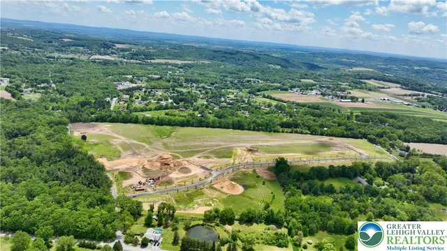 a view of a field with an ocean view