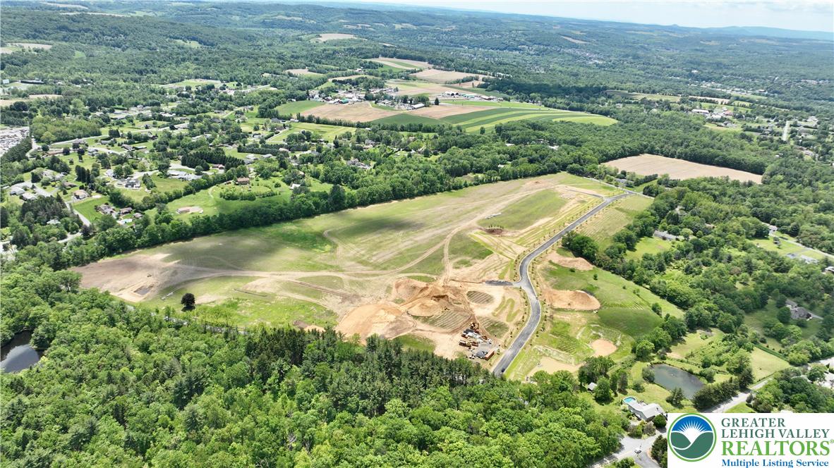 1225 Quince Road Walnutport, PA 18088 - Photo 16 of 50 an aerial view of residential houses with outdoor space and trees