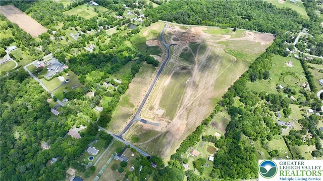 a view of a swimming pool with a yard