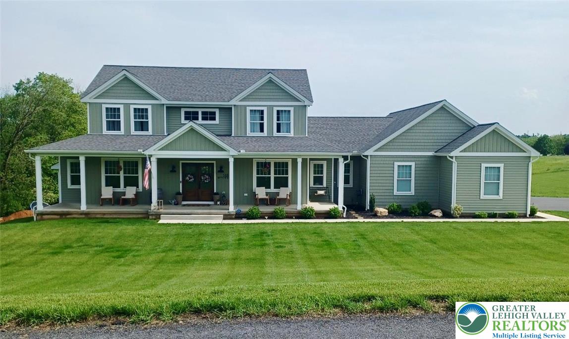 1225 Quince Road Walnutport, PA 18088 - Photo 3 of 50 a front view of a house with a yard