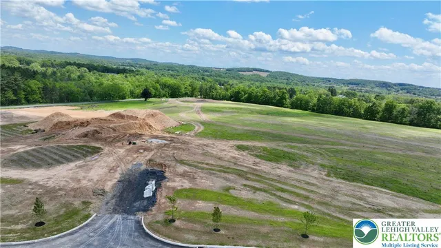a view of a swimming pool with a yard