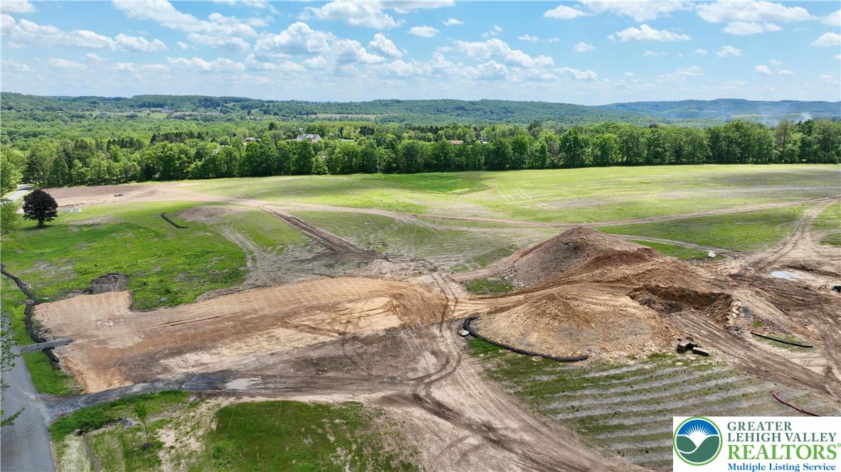 1225 Quince Road Walnutport, PA 18088 - Photo 37 of 50 a view of a lake with a city