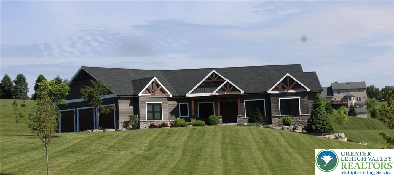 1225 Quince Road Walnutport, PA 18088 - Photo 4 of 50 a front view of a house with a yard