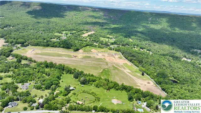 a view of a kitchen with kitchen island a counter tops pace a sink and a stove