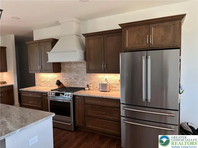 a kitchen with sink and cabinets