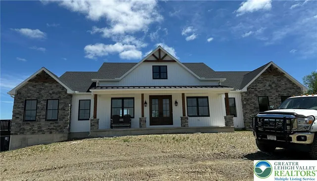 a front view of a house with parking space