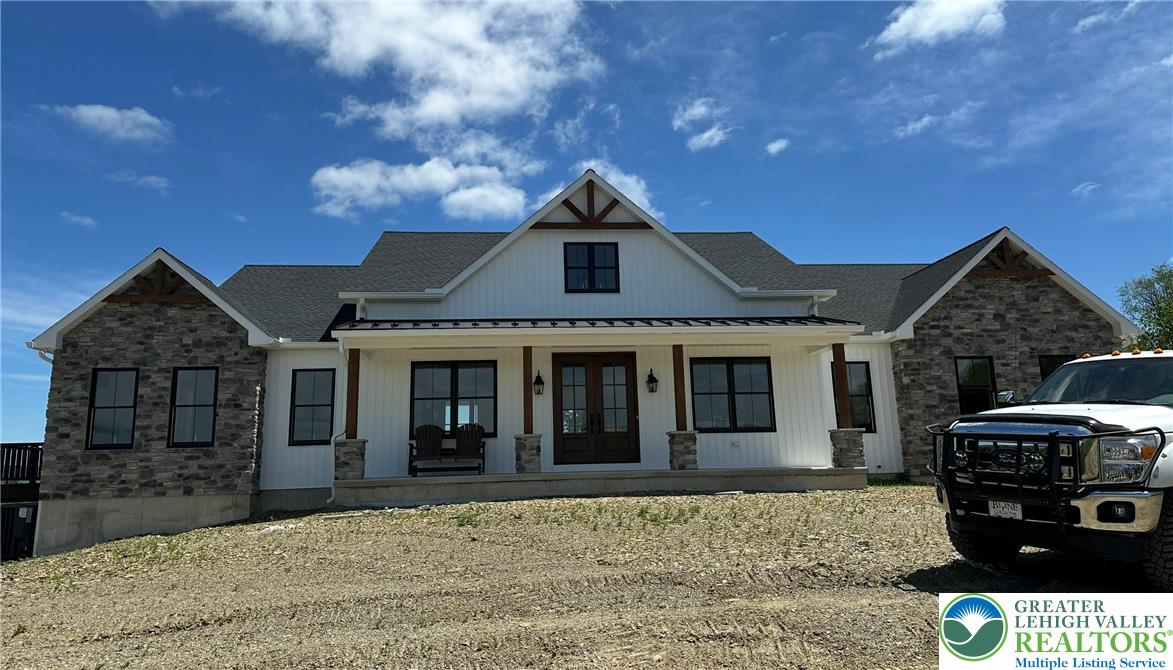 1225 Quince Road Walnutport, PA 18088 - Photo 6 of 50 a front view of a house with parking space