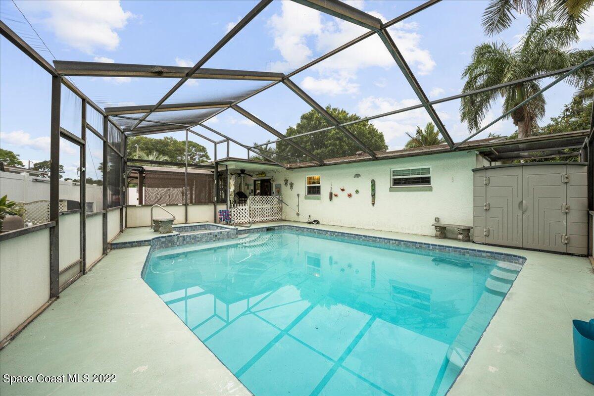 960 Kings Post Road Rockledge, FL 32955 - Photo 25 of 39 a view of a backyard with a patio and a yard