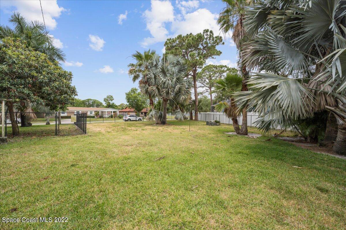 960 Kings Post Road Rockledge, FL 32955 - Photo 28 of 39 a view of yard with trees