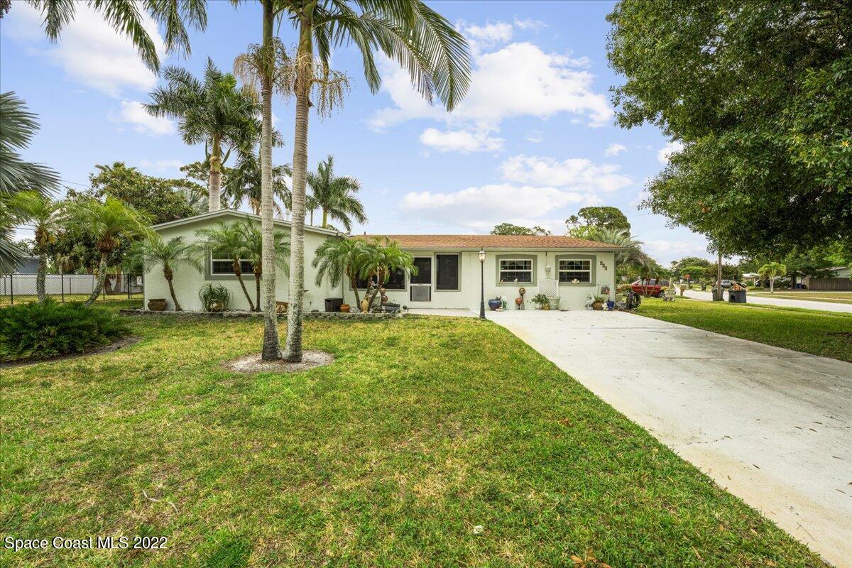 960 Kings Post Road Rockledge, FL 32955 - Photo 30 of 39 a view of multiple house with a yard