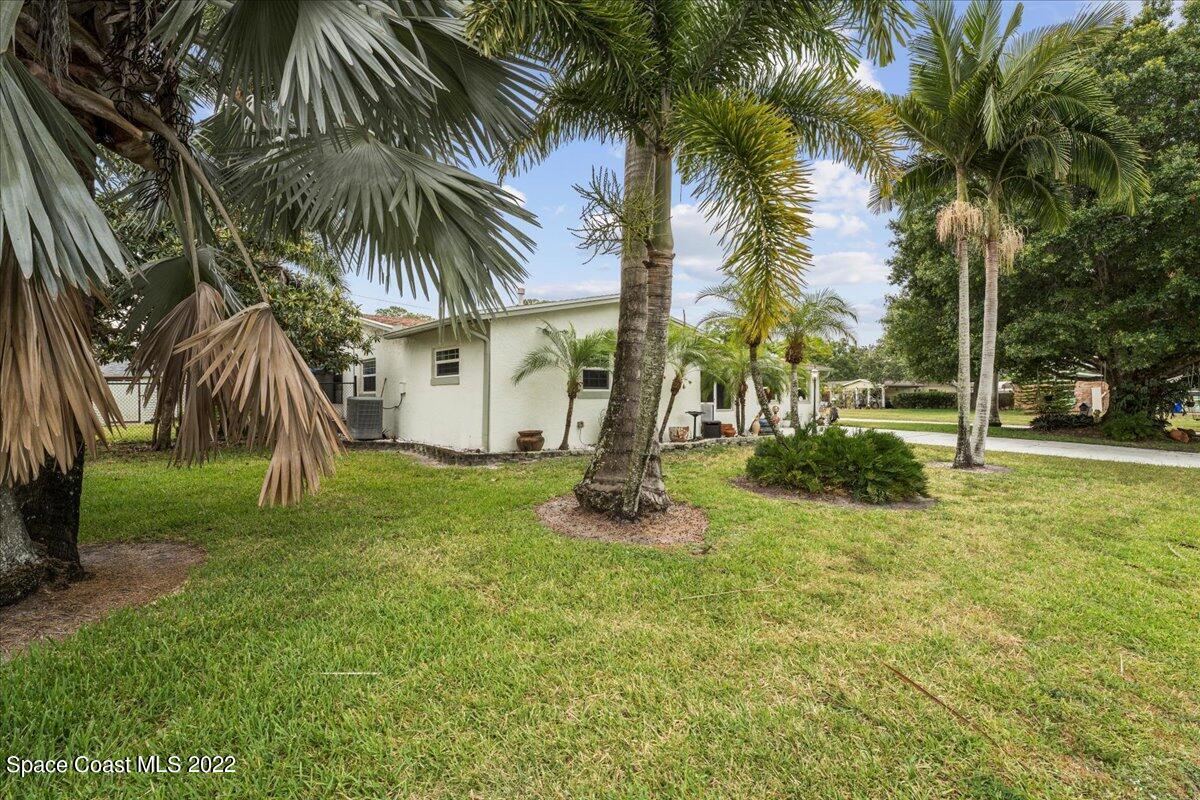 960 Kings Post Road Rockledge, FL 32955 - Photo 32 of 39 a front view of a house with a yard