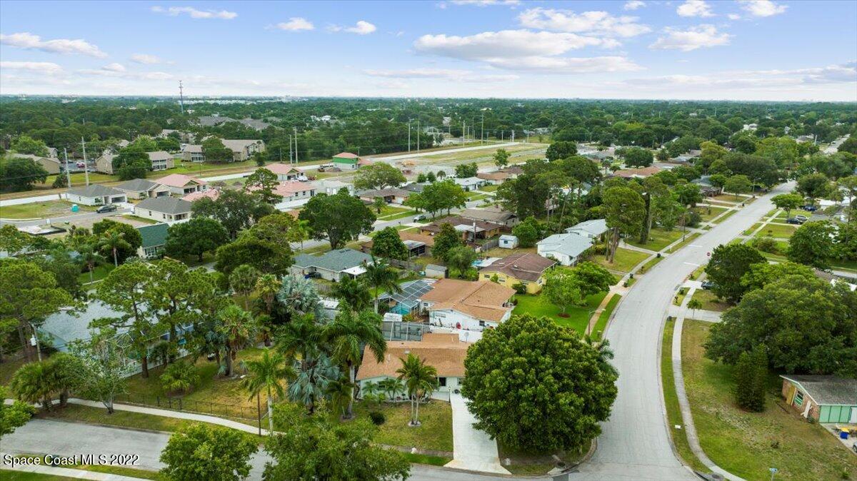 960 Kings Post Road Rockledge, FL 32955 - Photo 33 of 39 an aerial view of residential houses with outdoor space and trees