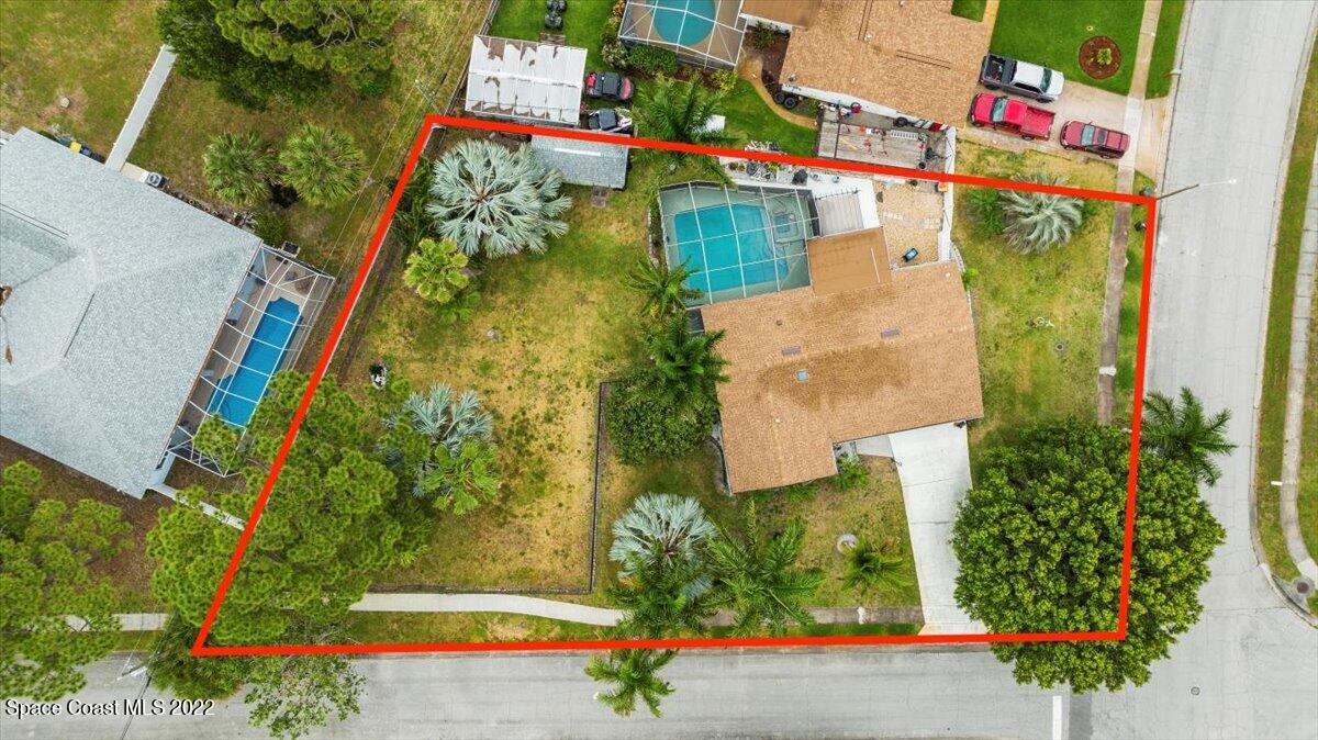 960 Kings Post Road Rockledge, FL 32955 - Photo 35 of 39 an aerial view of residential houses with outdoor space and swimming pool