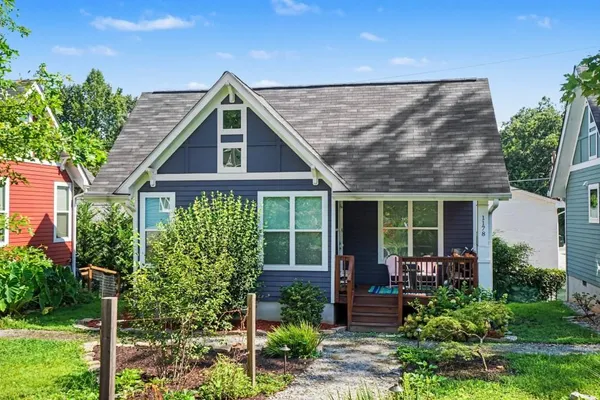 a front view of a house with garden