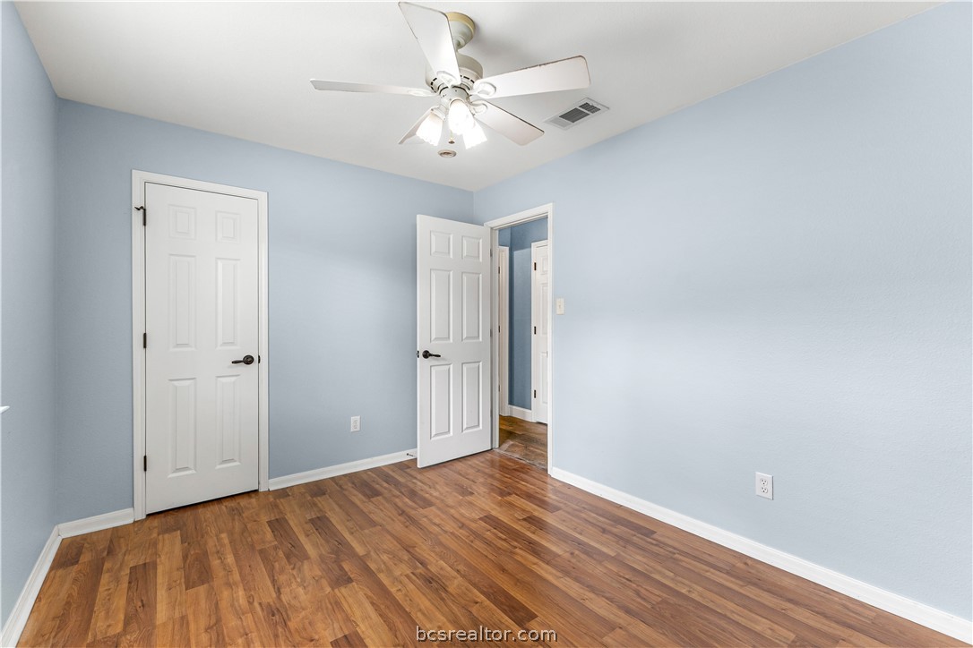 3709 Springfield Drive College Station, TX 77845 - Photo 18 of 23 a view of a room with wooden floor and a ceiling fan