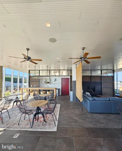 a living room with lots of furniture and clutter