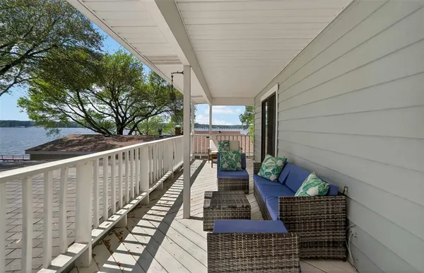 a view of a house with a yard and a patio