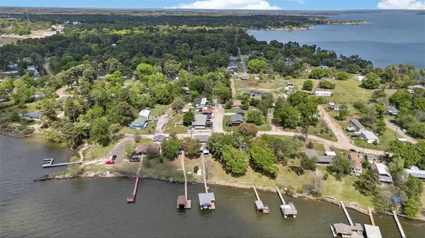 an aerial view of a houses with a yard