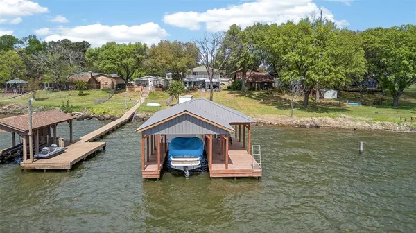 a swimming pool with outdoor seating and yard