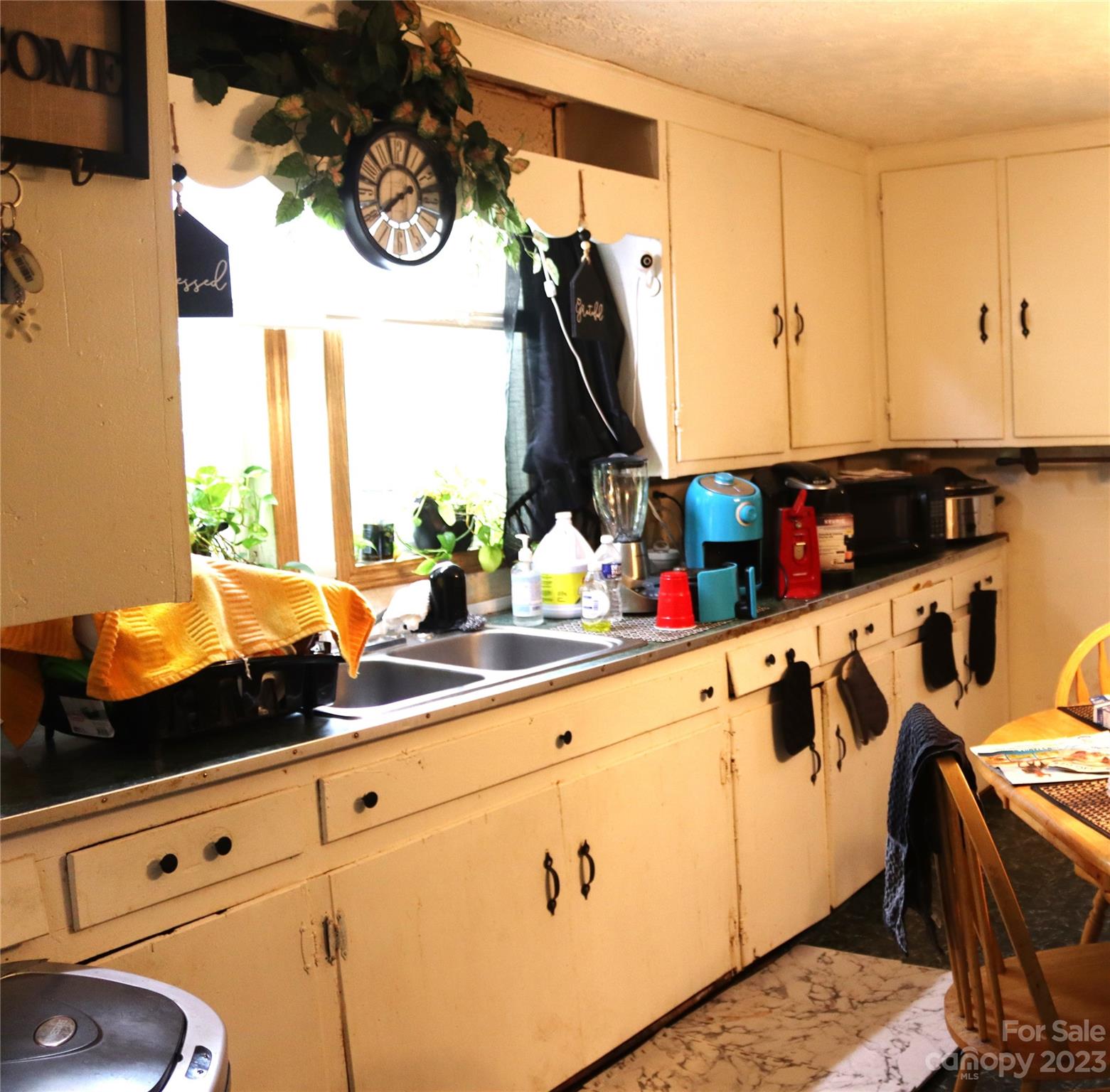 3105 Harmon Homestead Road Shelby, NC 28150 - Photo 3 of 8 a kitchen with white cabinets and window