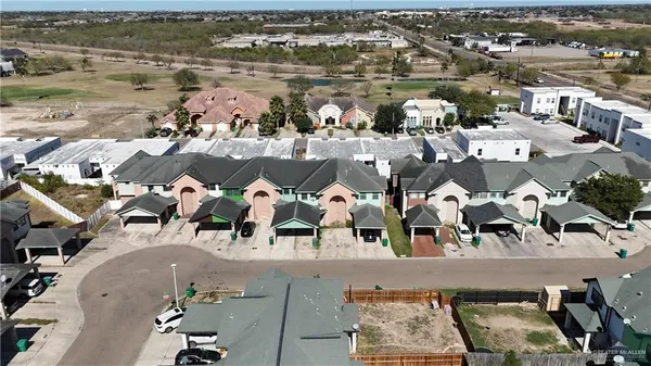 an aerial view of residential building with ocean