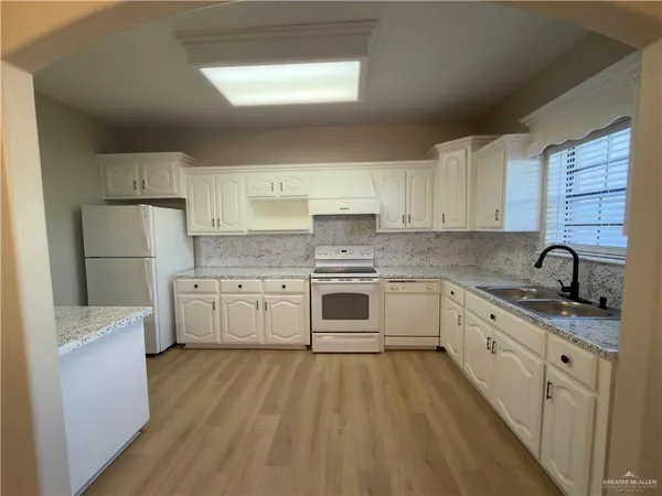 a view of a kitchen with a sink