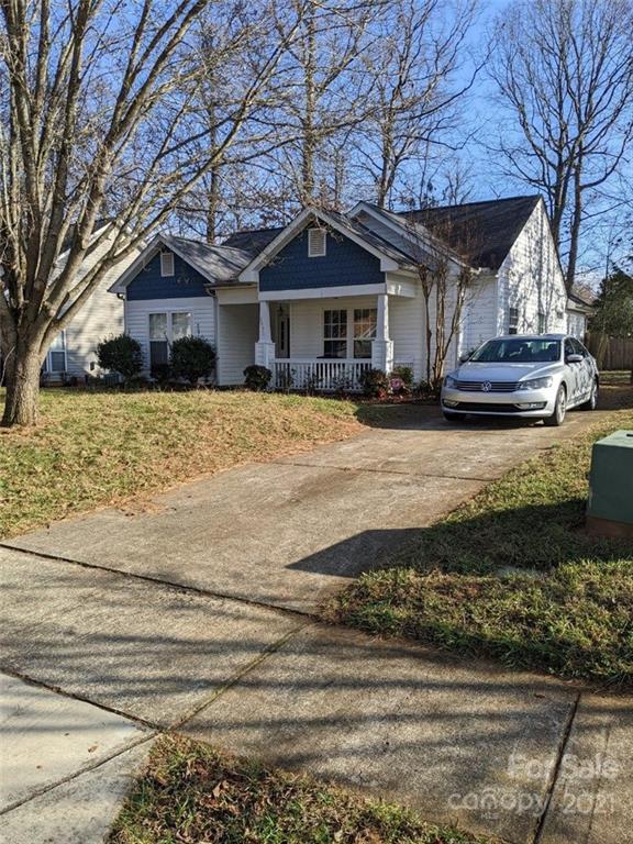 5030 Gibbons Link Road Charlotte, NC 28269 - Photo 1 of 28 a front view of a house with a yard
