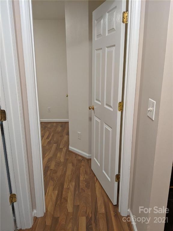 5030 Gibbons Link Road Charlotte, NC 28269 - Photo 13 of 28 a view of a hallway with wooden floor and staircase
