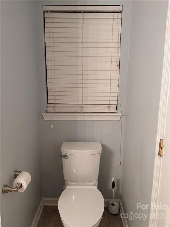 5030 Gibbons Link Road Charlotte, NC 28269 - Photo 16 of 28 a white toilet sitting next to a window