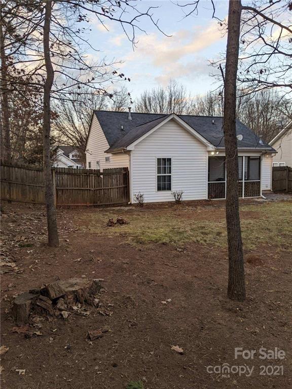 5030 Gibbons Link Road Charlotte, NC 28269 - Photo 24 of 28 a view of a house with a yard
