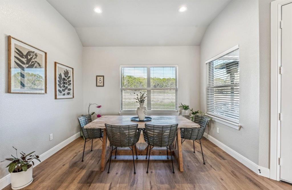2455 Schooner Way Bluff Dale, TX 76433 - Photo 9 of 37 Dining area with wood finished floors, lofted ceiling, a textured wall, and recessed lighting