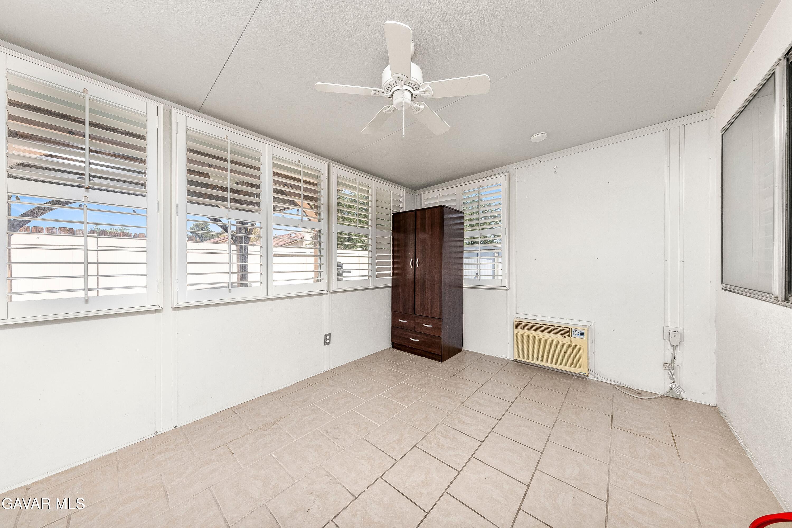 5767 East Ave R 11 Palmdale, CA 93552 - Photo 18 of 27 a view of an empty room with a window