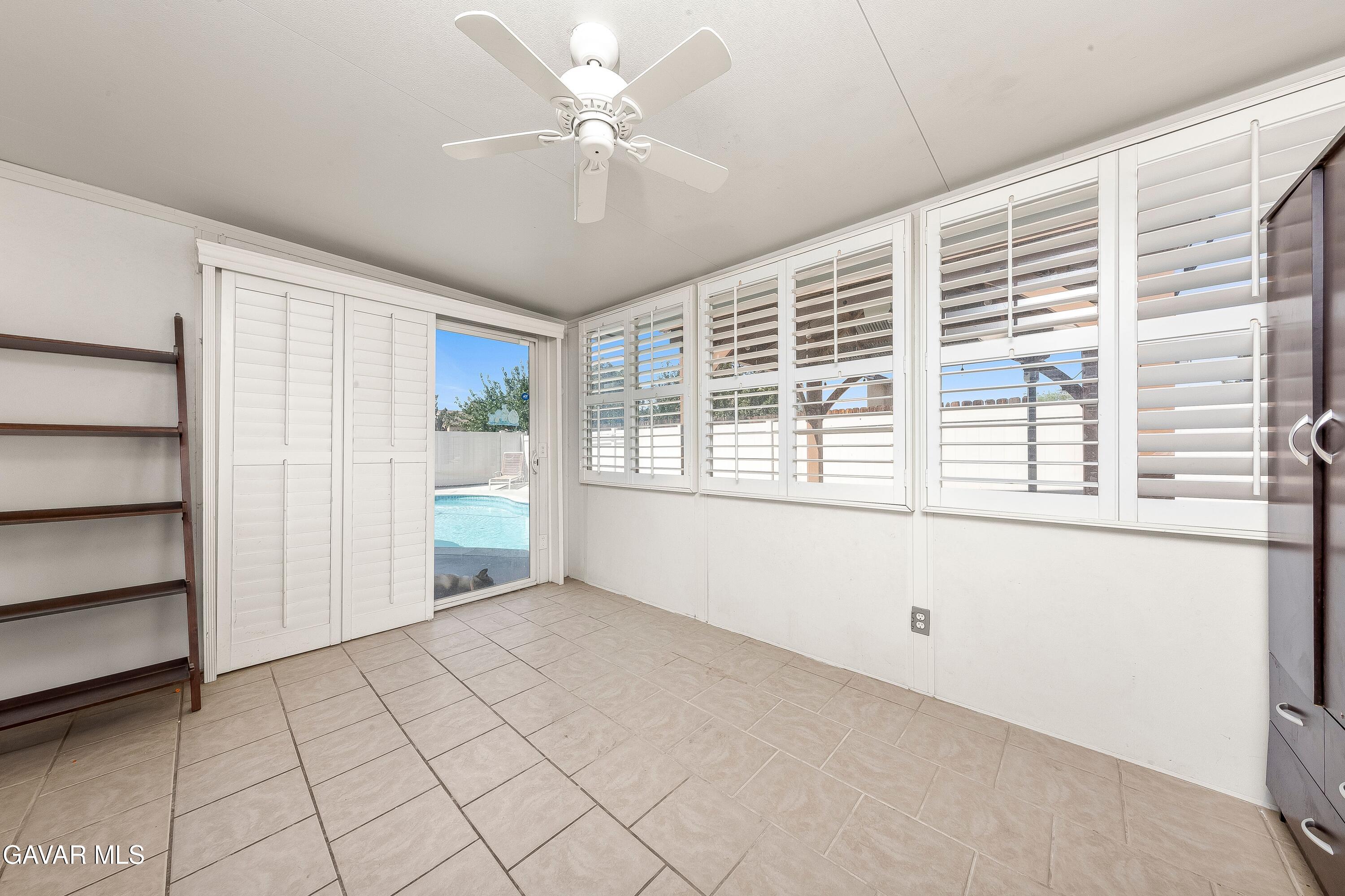 5767 East Ave R 11 Palmdale, CA 93552 - Photo 19 of 27 a view of an empty room with a window