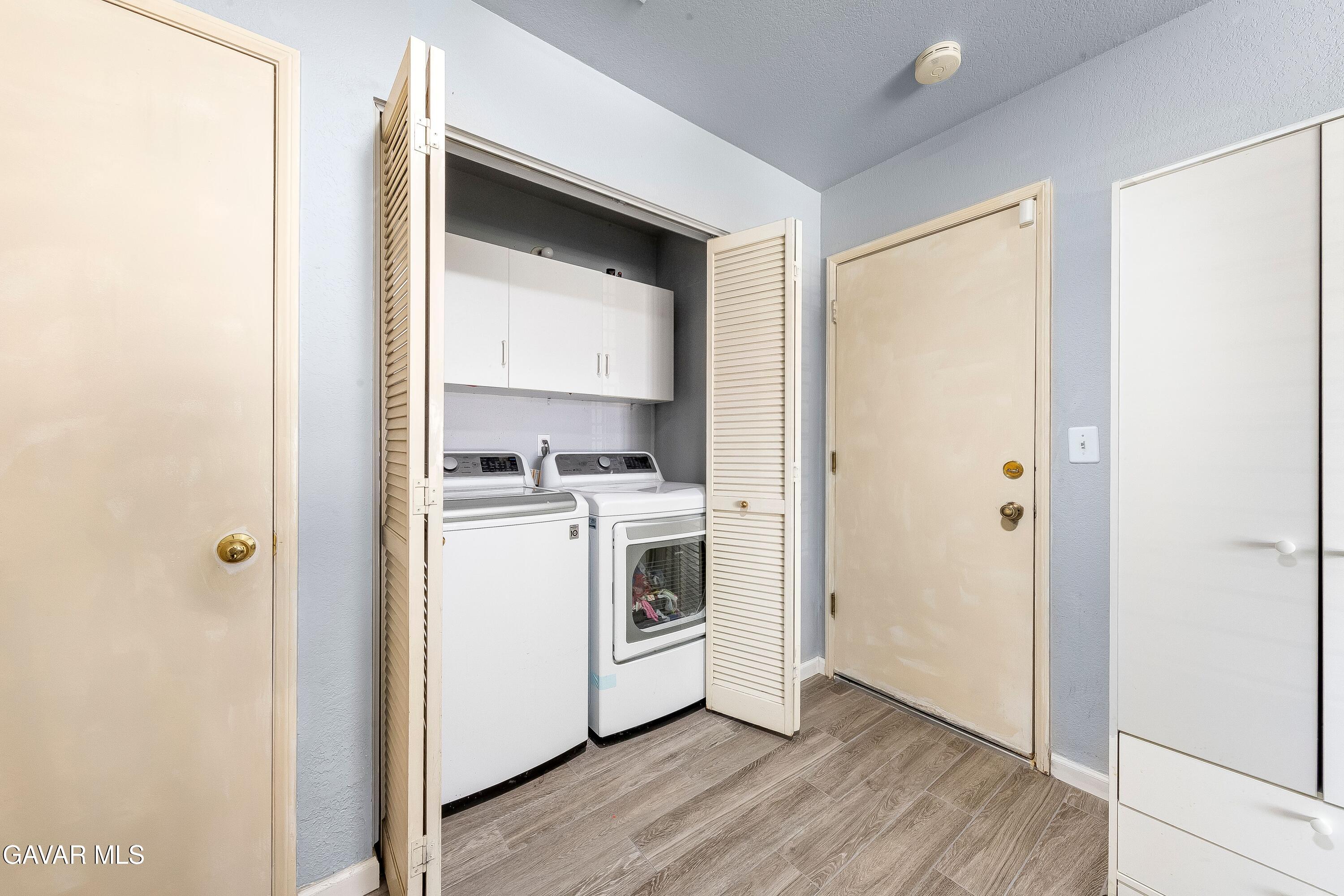 5767 East Ave R 11 Palmdale, CA 93552 - Photo 20 of 27 a view of kitchen and wooden floor