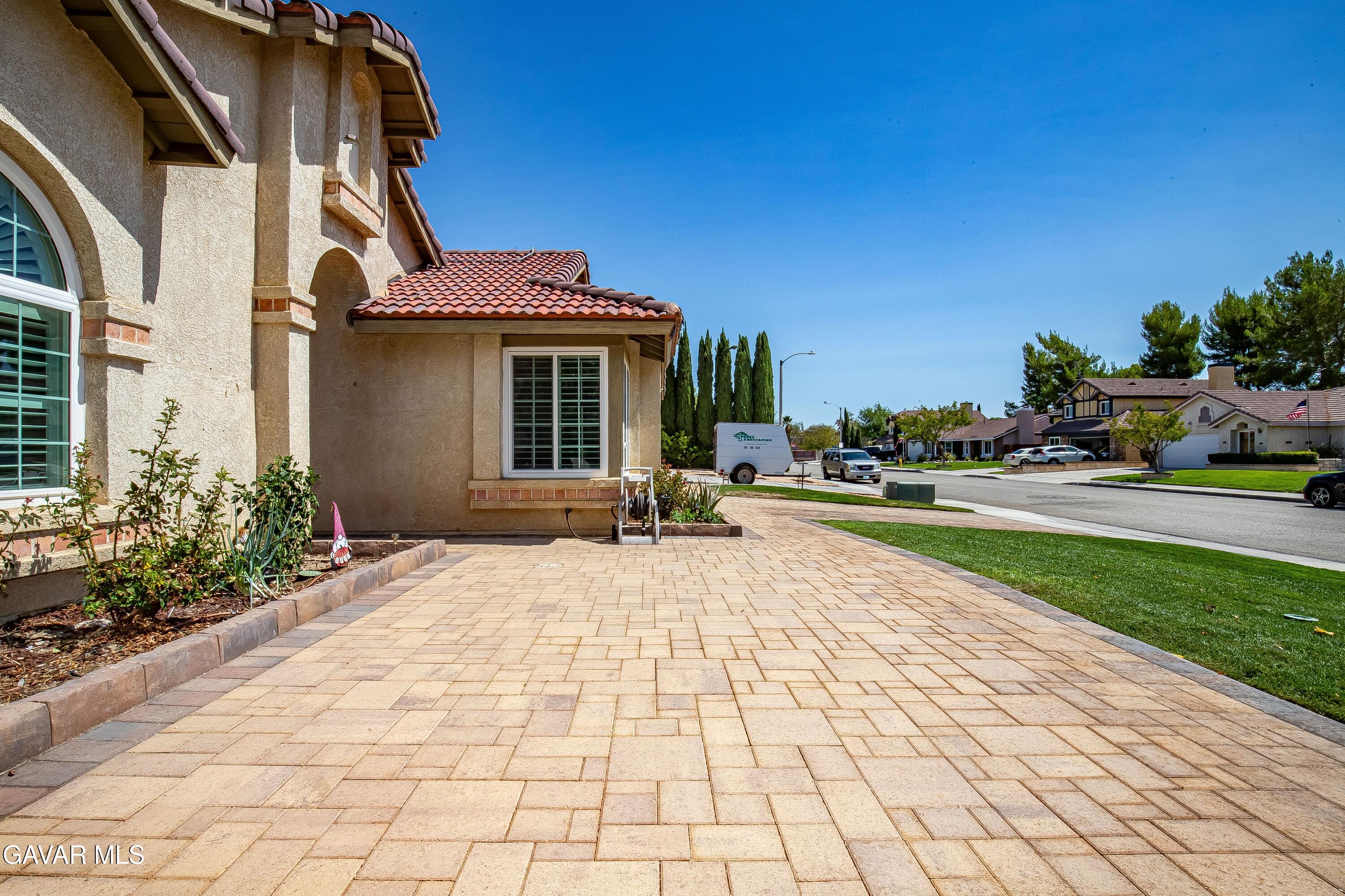 5767 East Ave R 11 Palmdale, CA 93552 - Photo 2 of 27 a view of outdoor space with garden