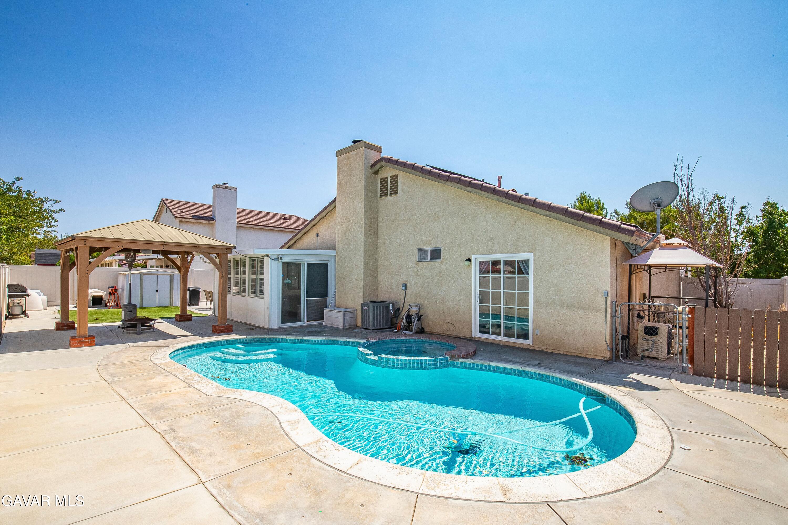 5767 East Ave R 11 Palmdale, CA 93552 - Photo 25 of 27 a view of a house with backyard
