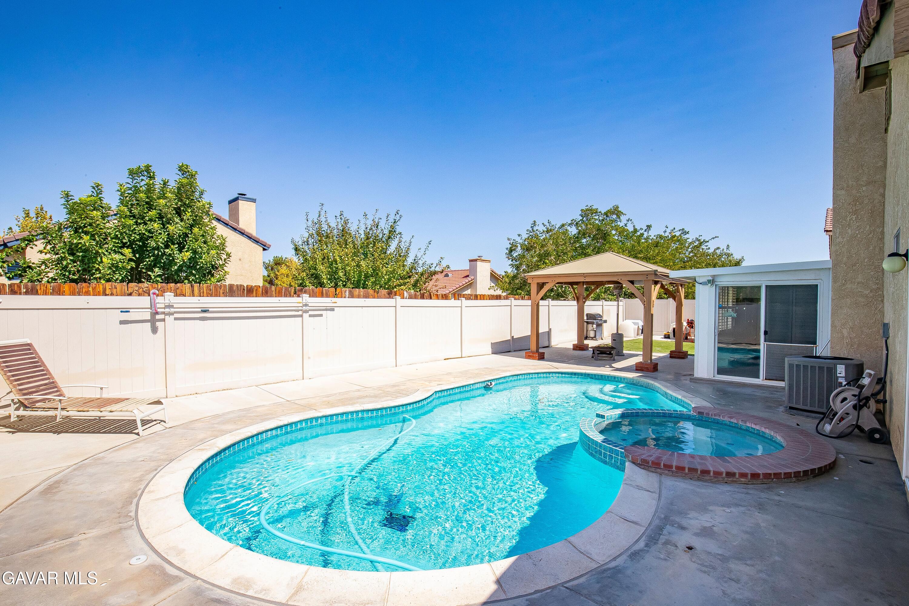 5767 East Ave R 11 Palmdale, CA 93552 - Photo 27 of 27 a view of a swimming pool with an outdoor seating