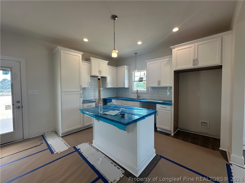 8383 Shannon Road Shannon, NC 28386 - Photo 4 of 17 a kitchen with stainless steel appliances granite countertop a sink a stove a refrigerator and island