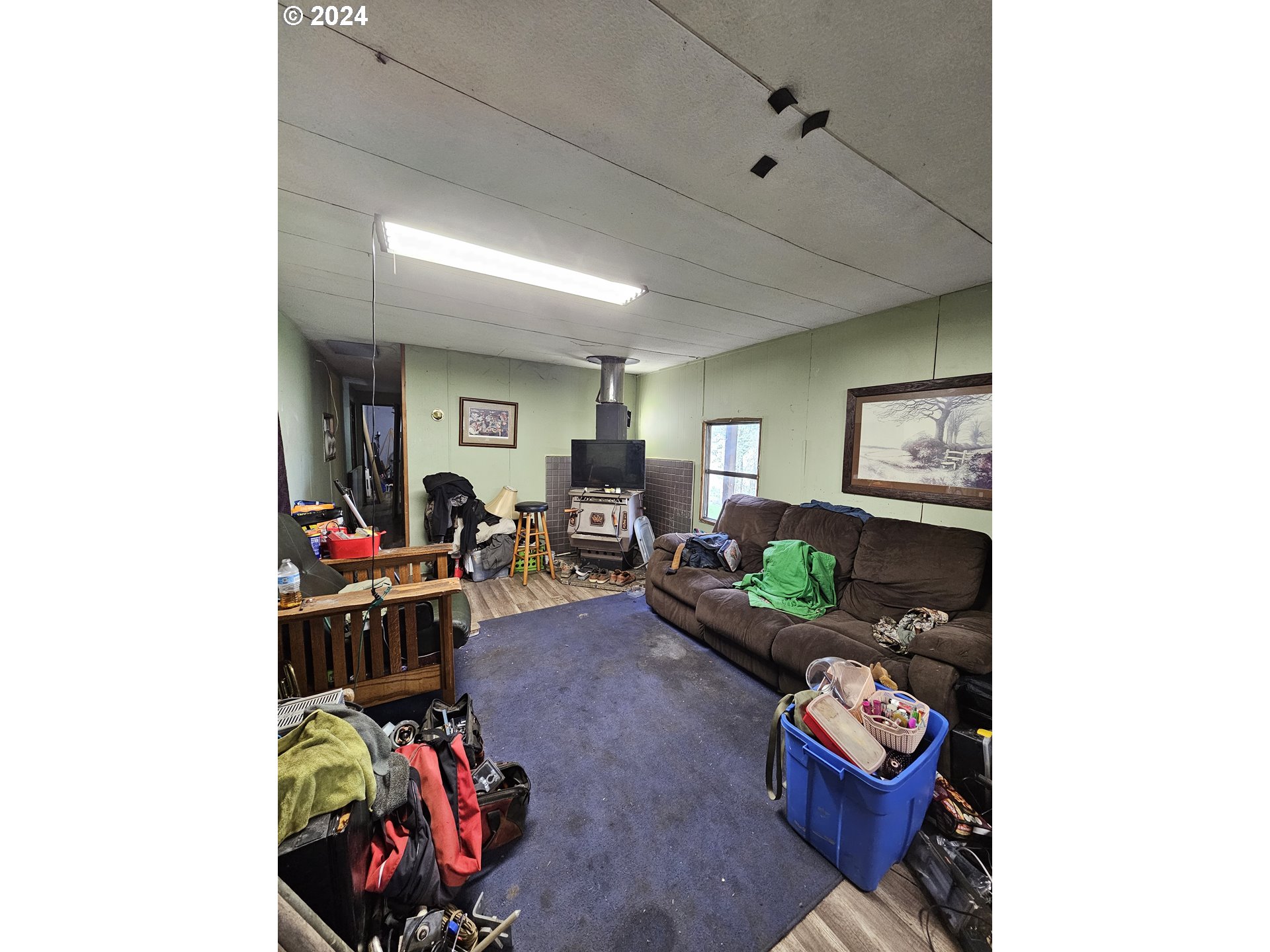 326 Rice Creek Road Winston, OR 97496 - Photo 11 of 22 a living room with furniture and a wooden floor