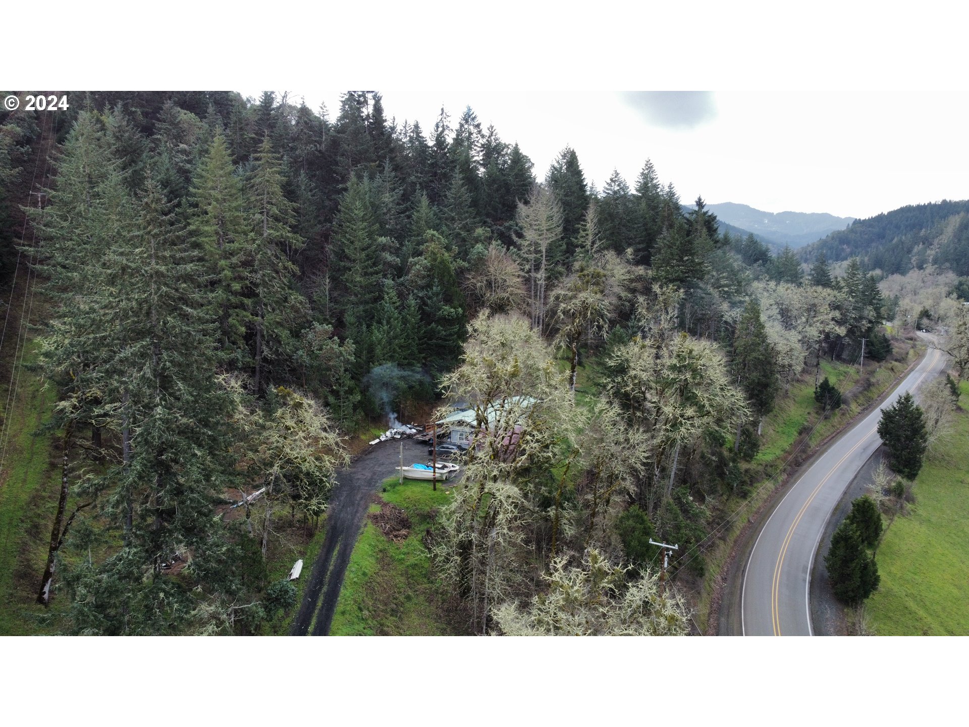 326 Rice Creek Road Winston, OR 97496 - Photo 17 of 22 a black and white photo of a house