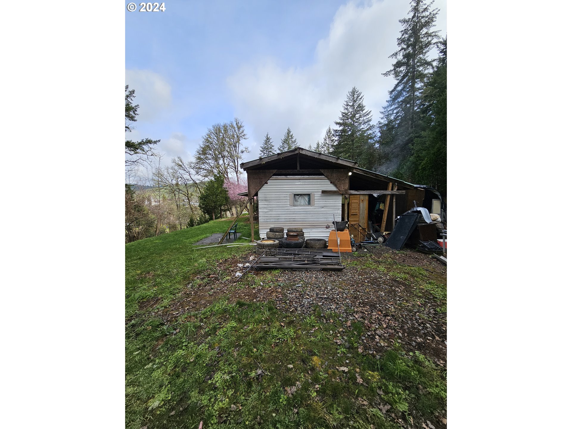 326 Rice Creek Road Winston, OR 97496 - Photo 4 of 22 a view of a tiny house with a yard
