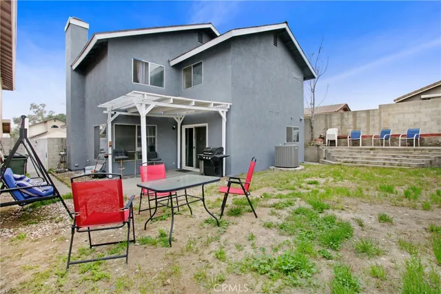 a view of a chairs and table in the patio
