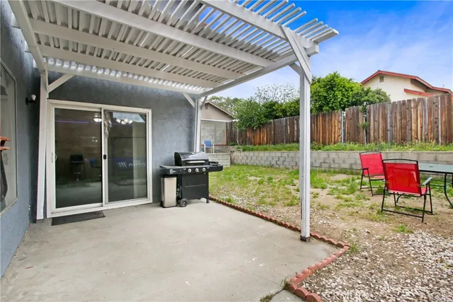 a view of a porch with furniture and a gate