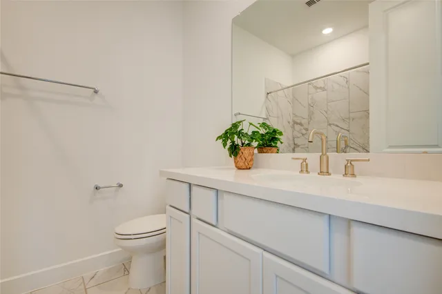 a kitchen with a sink stainless steel appliances and cabinets