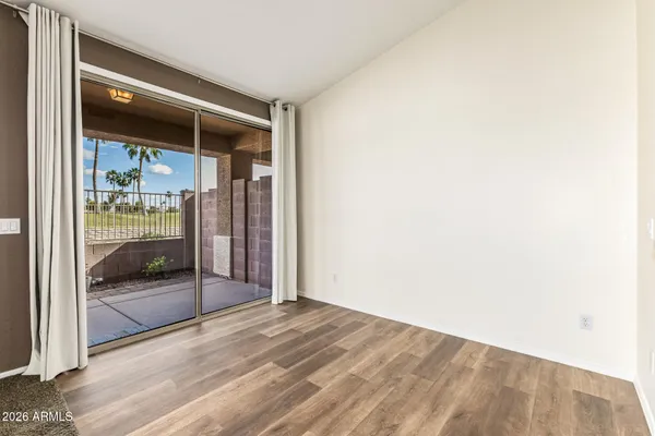 a view of a kitchen with a sink and dishwasher a refrigerator with wooden floor