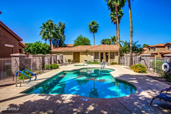 a view of swimming pool with a patio
